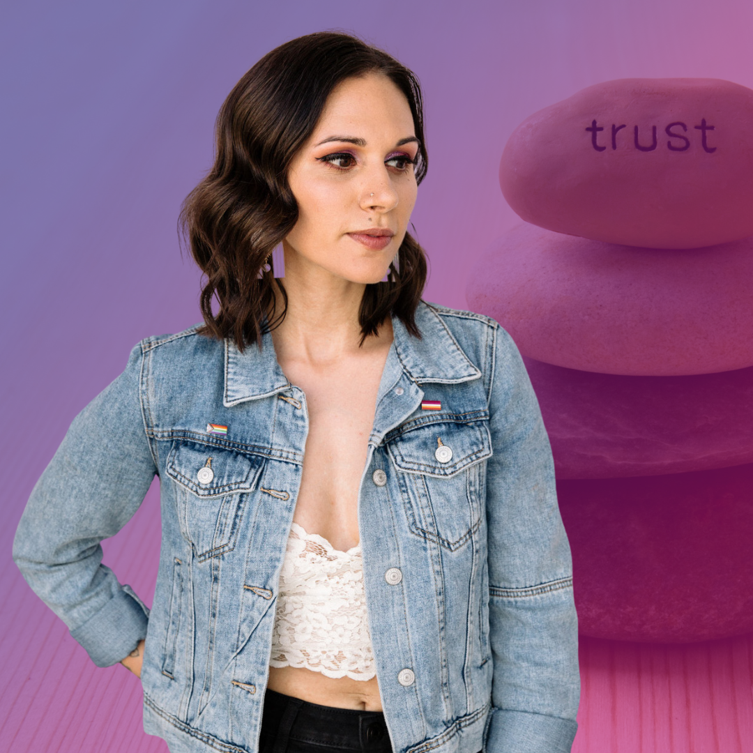 Shohreh Davoodi is looking off to the right. Purple earrings peek out from her wavy brown hair. She's wearing a jean jacket over a white lace top and black pants. The background is peaceful, 4 rocks stacked upon one another with the word 