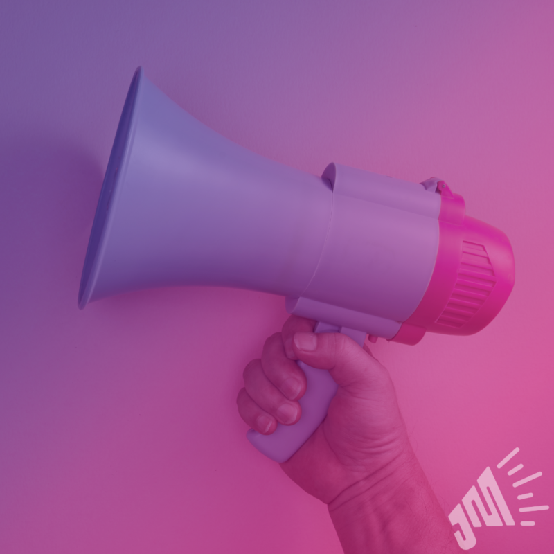 A hand holding a megaphone. The image has a gradient overlay of purple and pink.